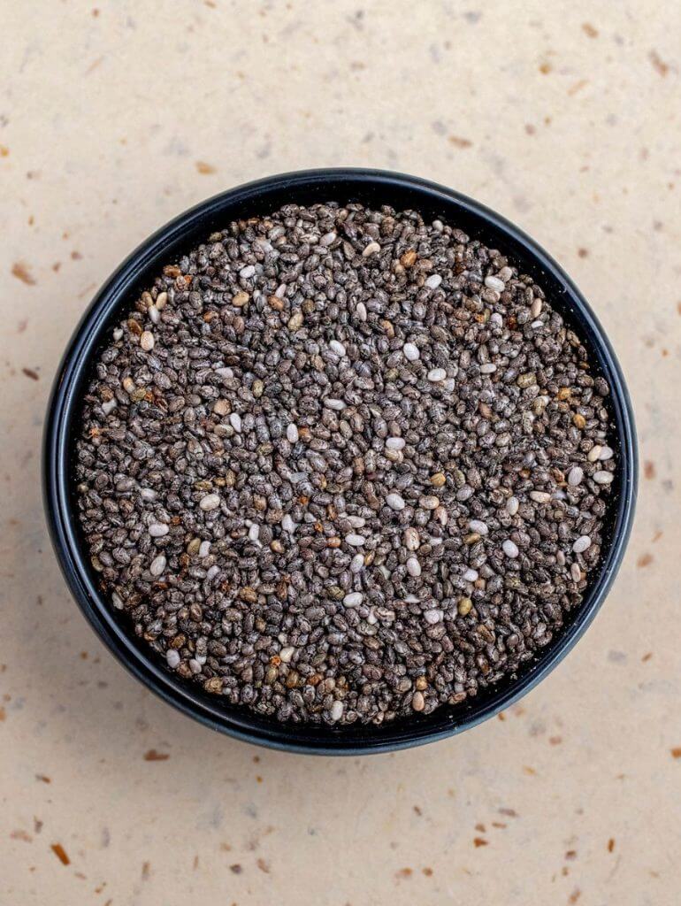Chia seeds in a black bowl