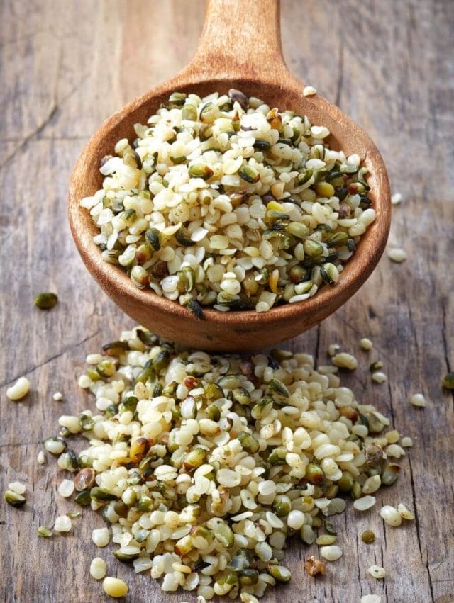 Hulled hemp seeds in a wooden bowl